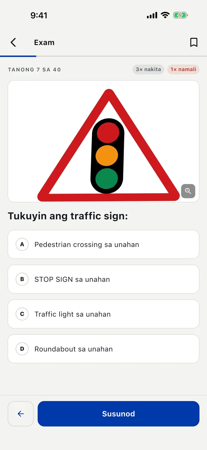 Isang tanong sa mock exam sa Filipino na may larawan ng karatula sa daan.